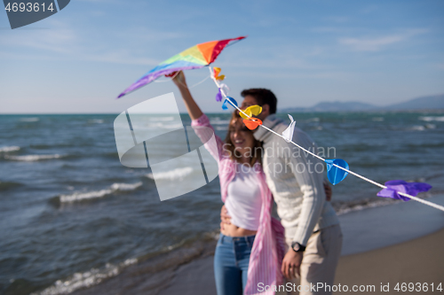 Image of Couple enjoying time together at beach