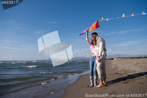 Image of Couple enjoying time together at beach