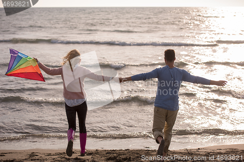 Image of Couple enjoying time together at beach