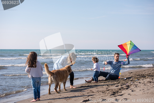 Image of happy young family enjoying vecation during autumn day