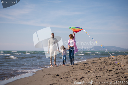 Image of happy family enjoying vecation during autumn day