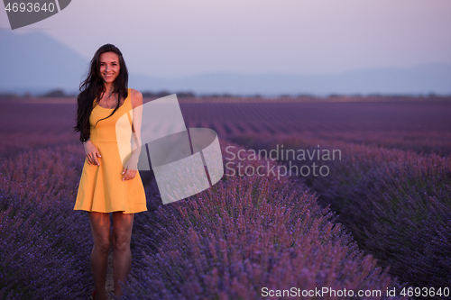 Image of woman in yellow dress at lavender field