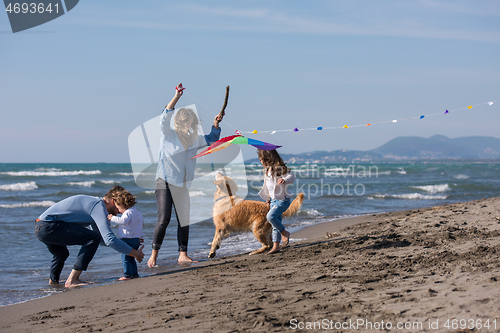 Image of happy young family enjoying vecation during autumn day