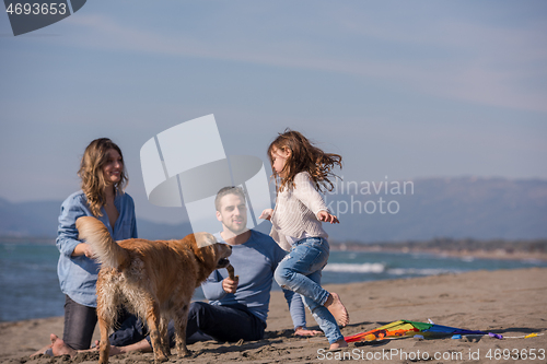 Image of happy young family enjoying vecation during autumn day