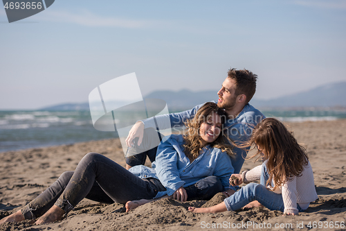 Image of Young family enjoying vecation during autumn