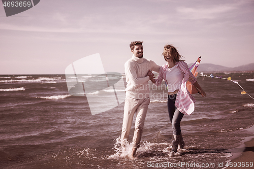 Image of Couple enjoying time together at beach