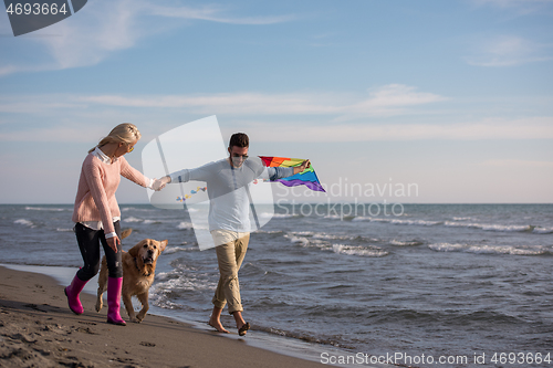 Image of happy couple enjoying time together at beach