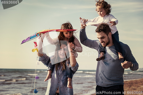 Image of happy family enjoying vecation during autumn day