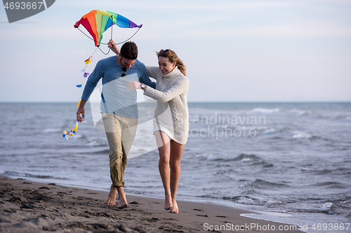 Image of Couple enjoying time together at beach