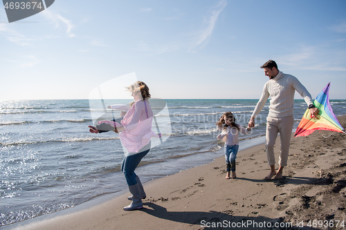 Image of happy family enjoying vecation during autumn day