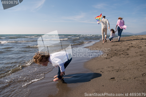 Image of happy family enjoying vecation during autumn day