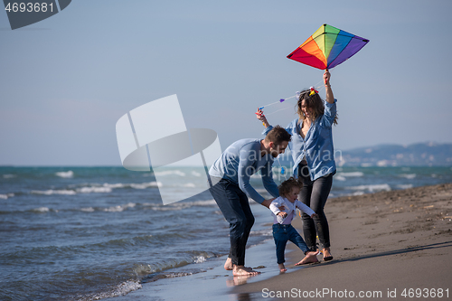 Image of happy family enjoying vecation during autumn day