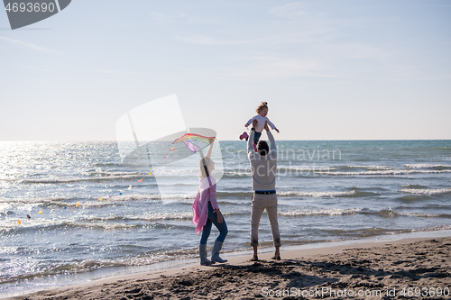 Image of happy family enjoying vecation during autumn day