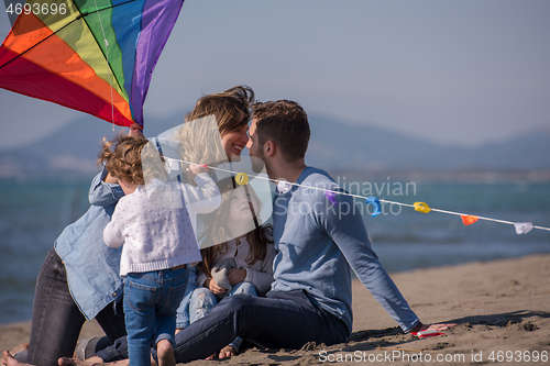 Image of happy family enjoying vecation during autumn day