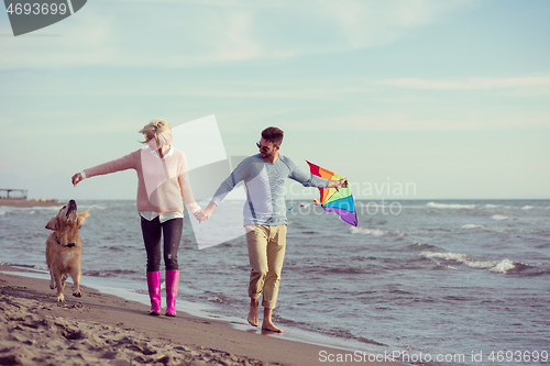 Image of happy couple enjoying time together at beach