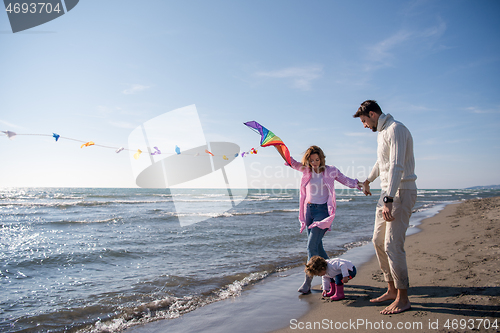 Image of happy family enjoying vecation during autumn day
