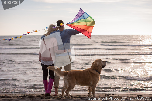 Image of happy couple enjoying time together at beach