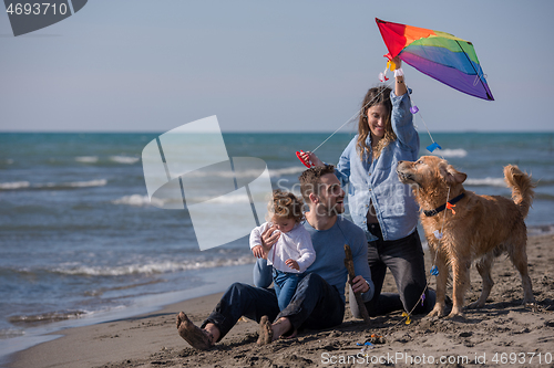 Image of happy young family enjoying vecation during autumn day