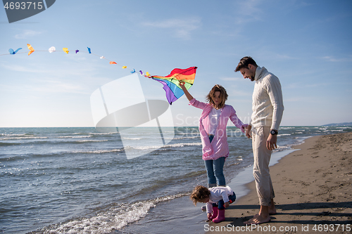 Image of happy family enjoying vecation during autumn day