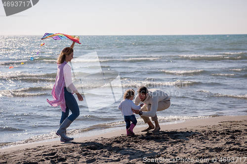 Image of happy family enjoying vecation during autumn day