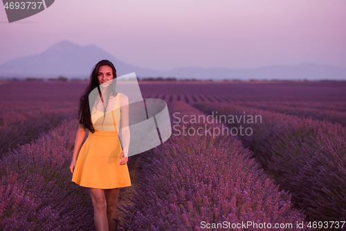 Image of woman in yellow dress at lavender field