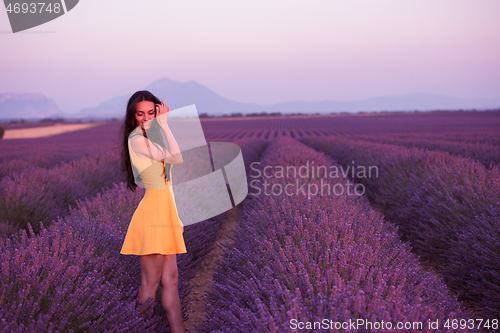 Image of woman in yellow dress at lavender field