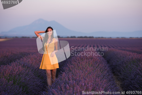 Image of woman in yellow dress at lavender field