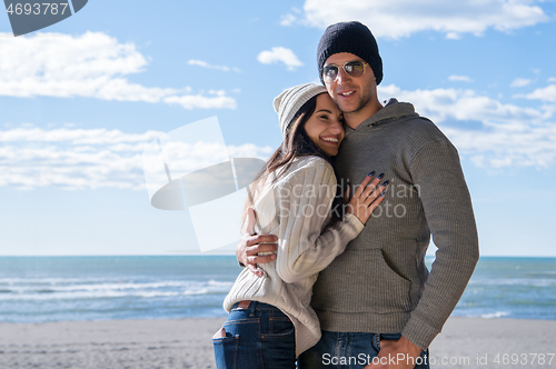 Image of Couple chating and having fun at beach bar