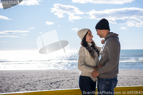 Image of Couple chating and having fun at beach bar