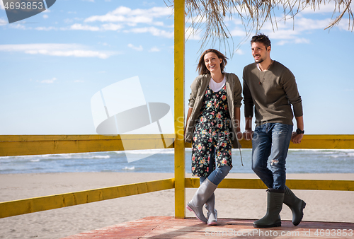 Image of Couple chating and having fun at beach bar