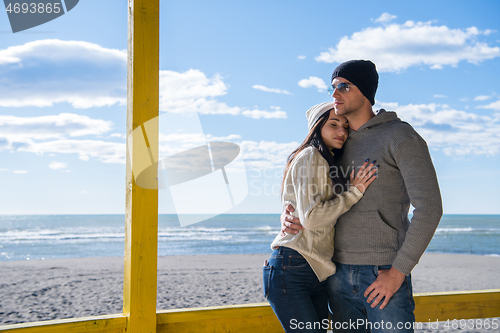 Image of Couple chating and having fun at beach bar