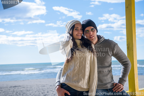 Image of Couple chating and having fun at beach bar