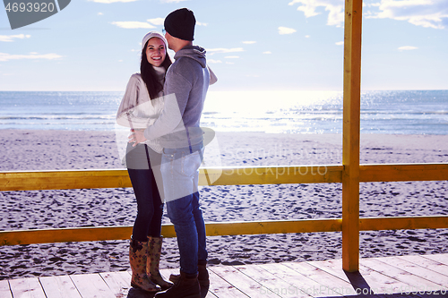 Image of Couple chating and having fun at beach bar