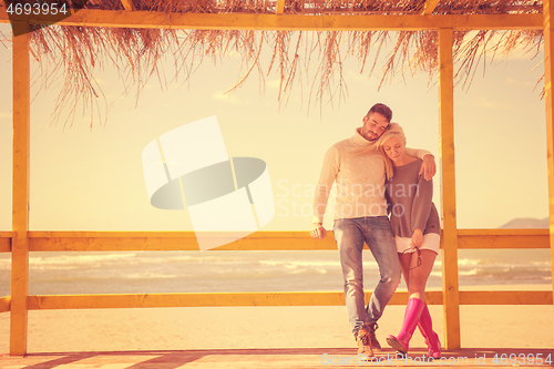 Image of Couple chating and having fun at beach bar