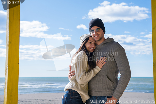 Image of Couple chating and having fun at beach bar