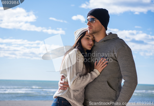 Image of Couple chating and having fun at beach bar