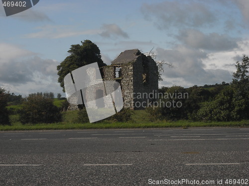 Image of old house beside motorway