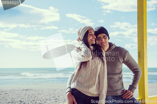 Image of Couple chating and having fun at beach bar