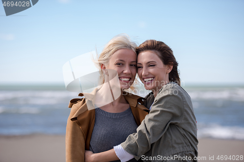 Image of Women Smiling And Enjoying Life at Beach