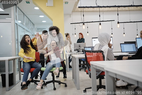 Image of racing on office chairs