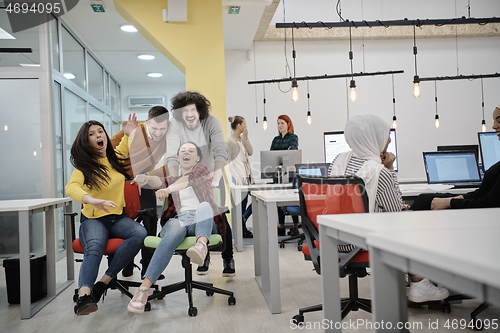 Image of racing on office chairs