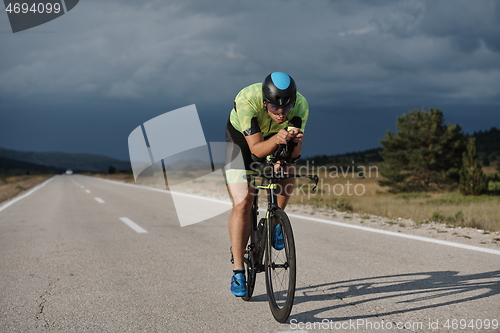 Image of triathlon athlete riding bike