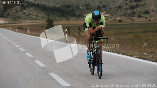 Image of triathlon athlete riding bike