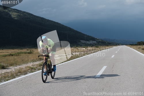 Image of triathlon athlete riding bike