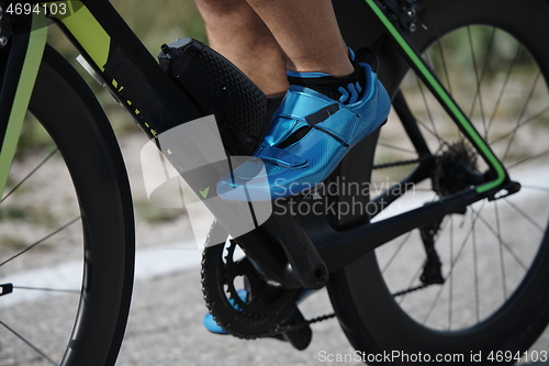 Image of closeup of triathlon athlete riding bike