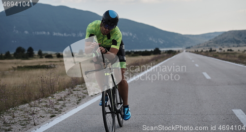 Image of triathlon athlete riding bike