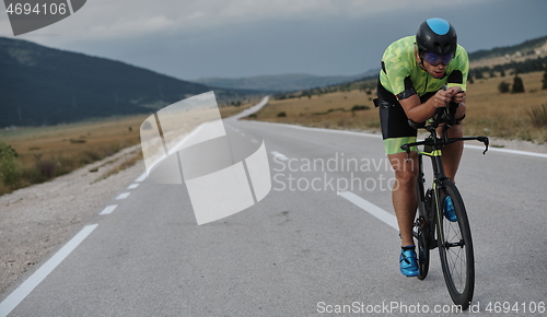 Image of triathlon athlete riding bike