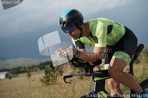 Image of triathlon athlete riding bike