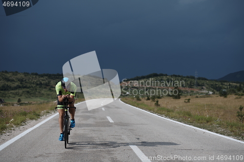 Image of triathlon athlete riding bike