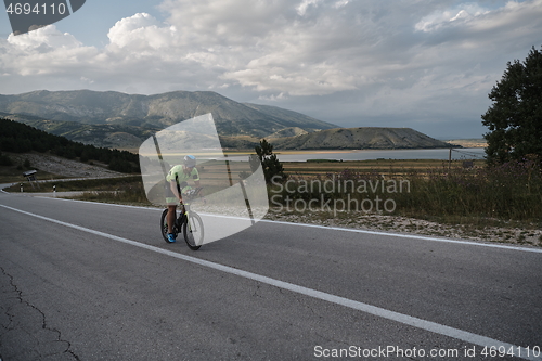 Image of triathlon athlete riding bike